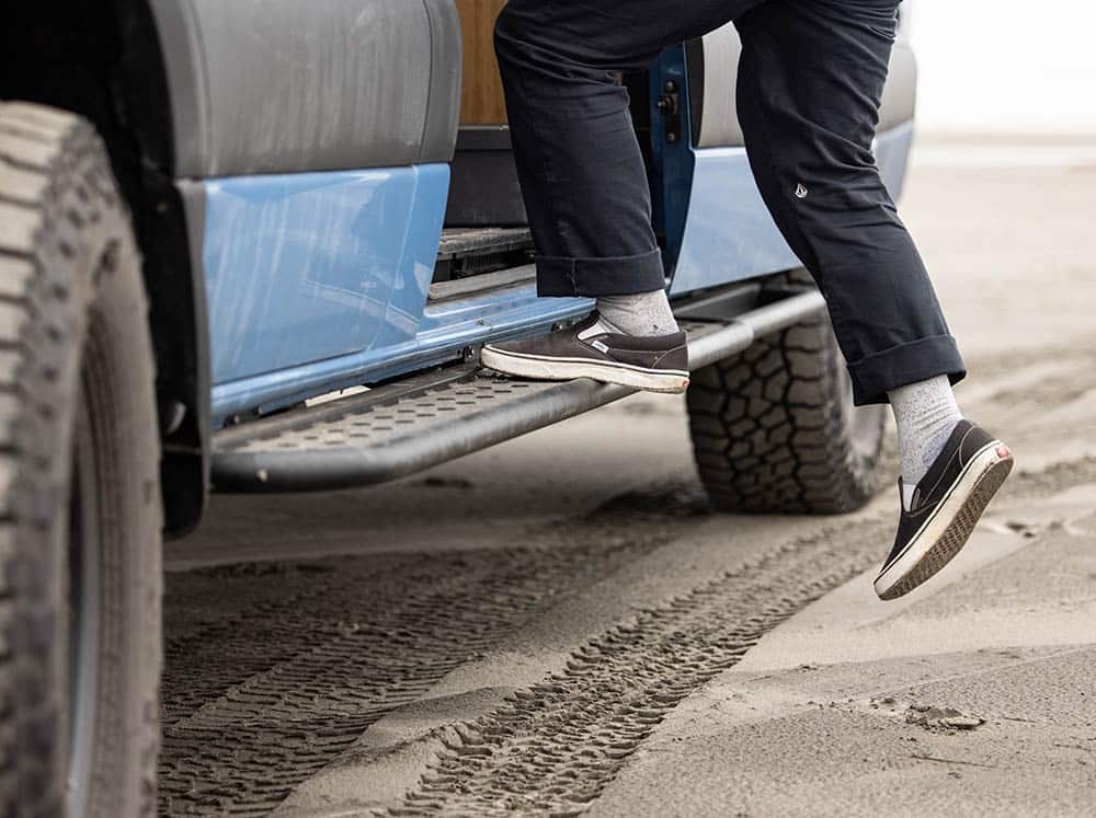 Person stepping on side step